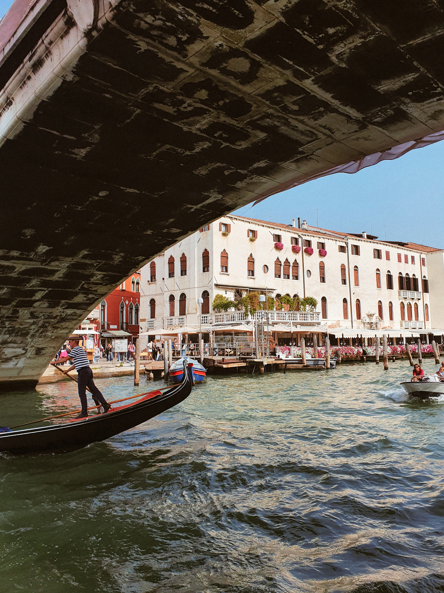 Passing under a bridge in Venice